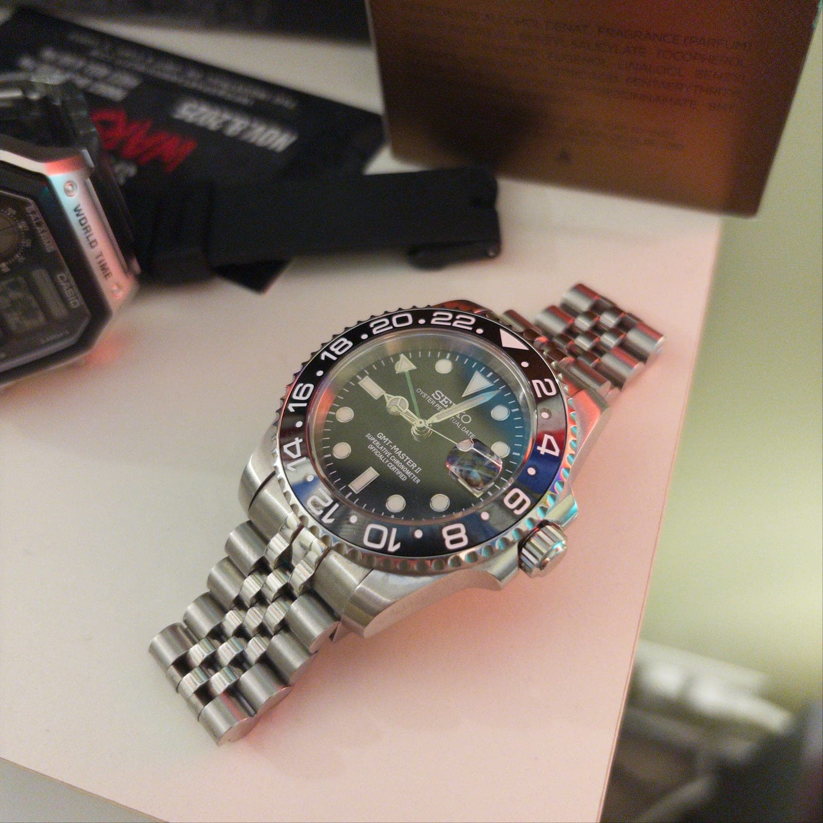 The finished 001C: black and grey GMT bezel, black dial, steel jubilee bracelet